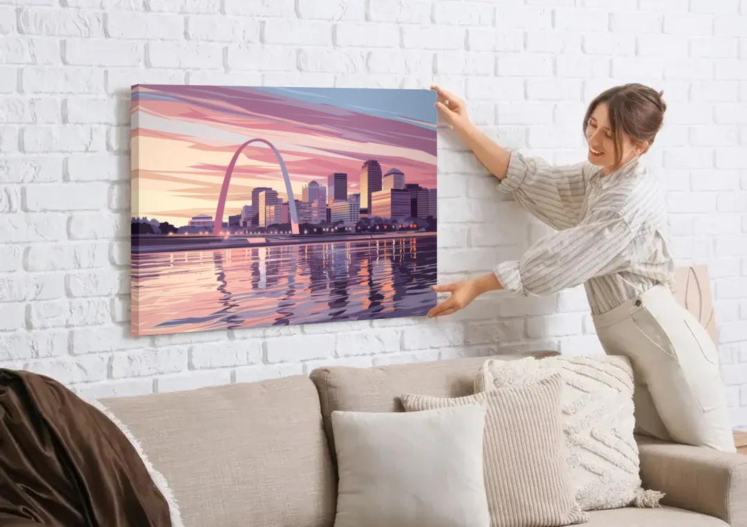 St. Louis Riverfront Panorama canvas wall art being hung on a white brick wall above a sofa