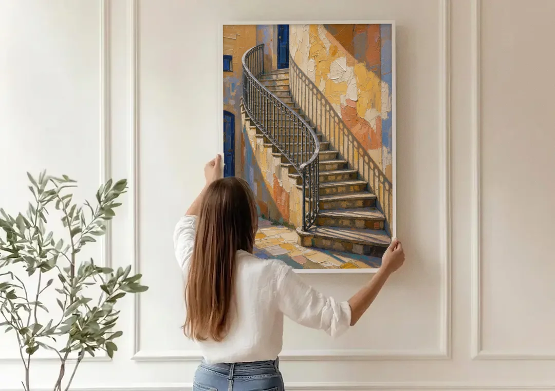 Stairway Wall Art with Curving Iron Railing canvas wall art being hung on a paneled wall