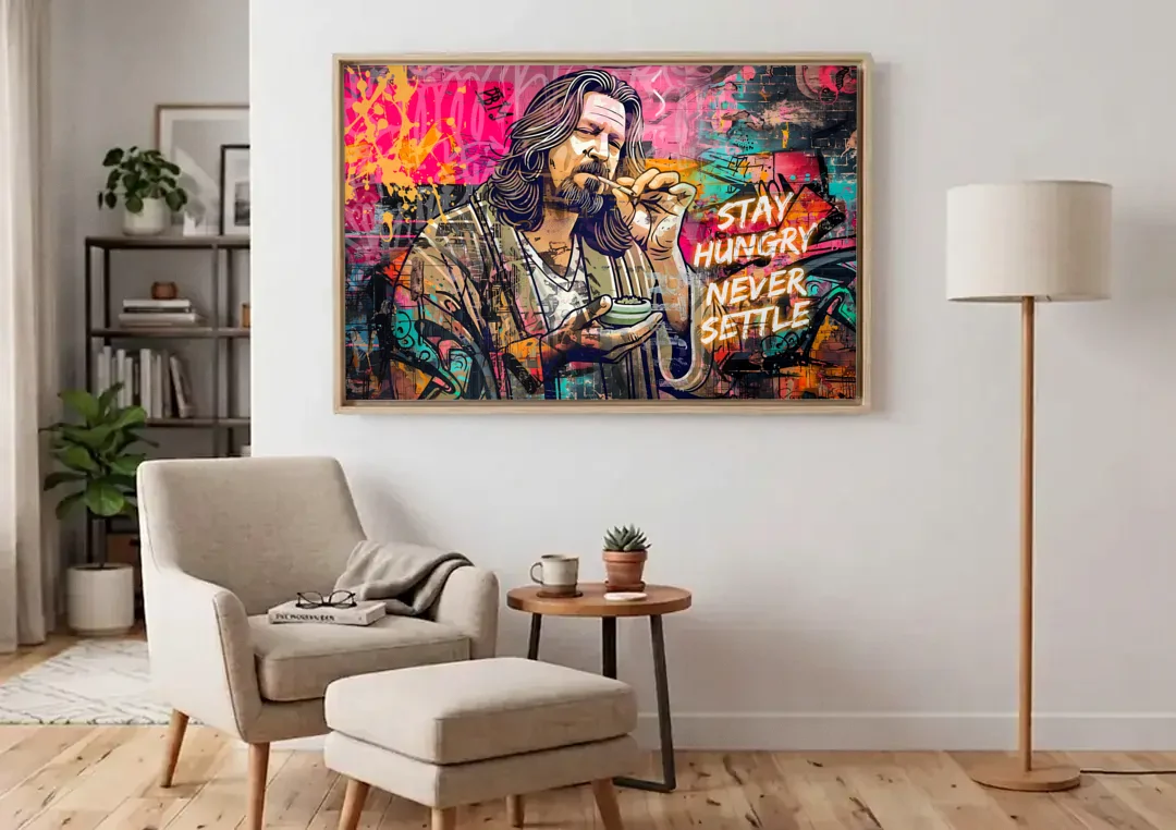 Stay Hungry Never Settle canvas wall art above an armchair in a bright living room
