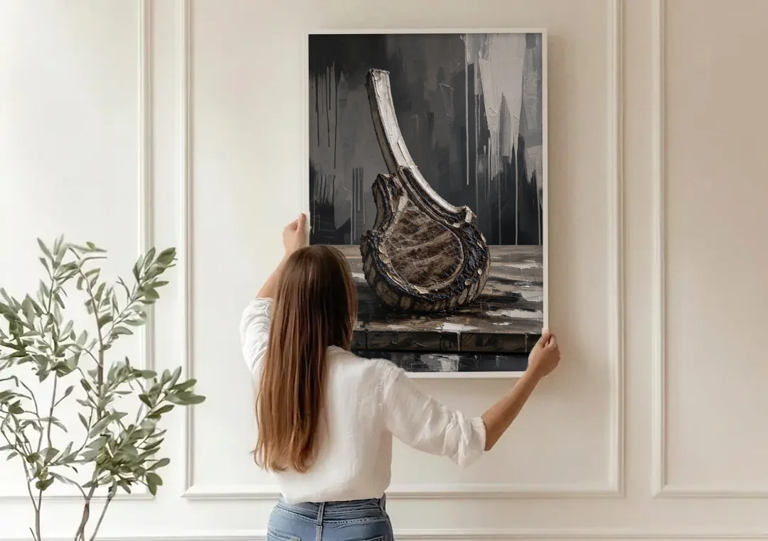 Steakhouse Decor Tomahawk Ribeye on the Board canvas wall art being hung on a paneled wall