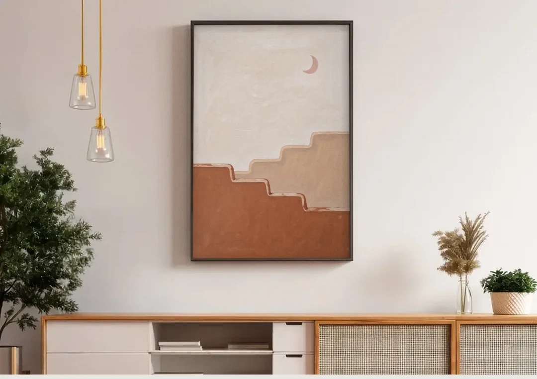 Stepped Adobe Wall Under a Crescent Moon canvas wall art above a wooden sideboard under pendant lights
