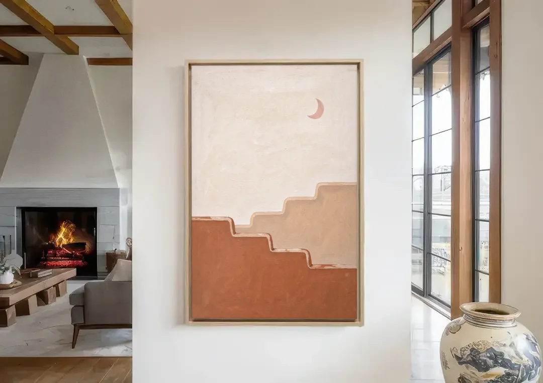 Stepped Adobe Wall Under a Crescent Moon canvas wall art in a living room with a fireplace