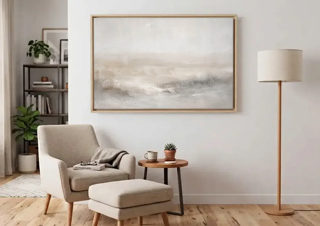 Stillness in Motion canvas wall art above an armchair in a bright living room