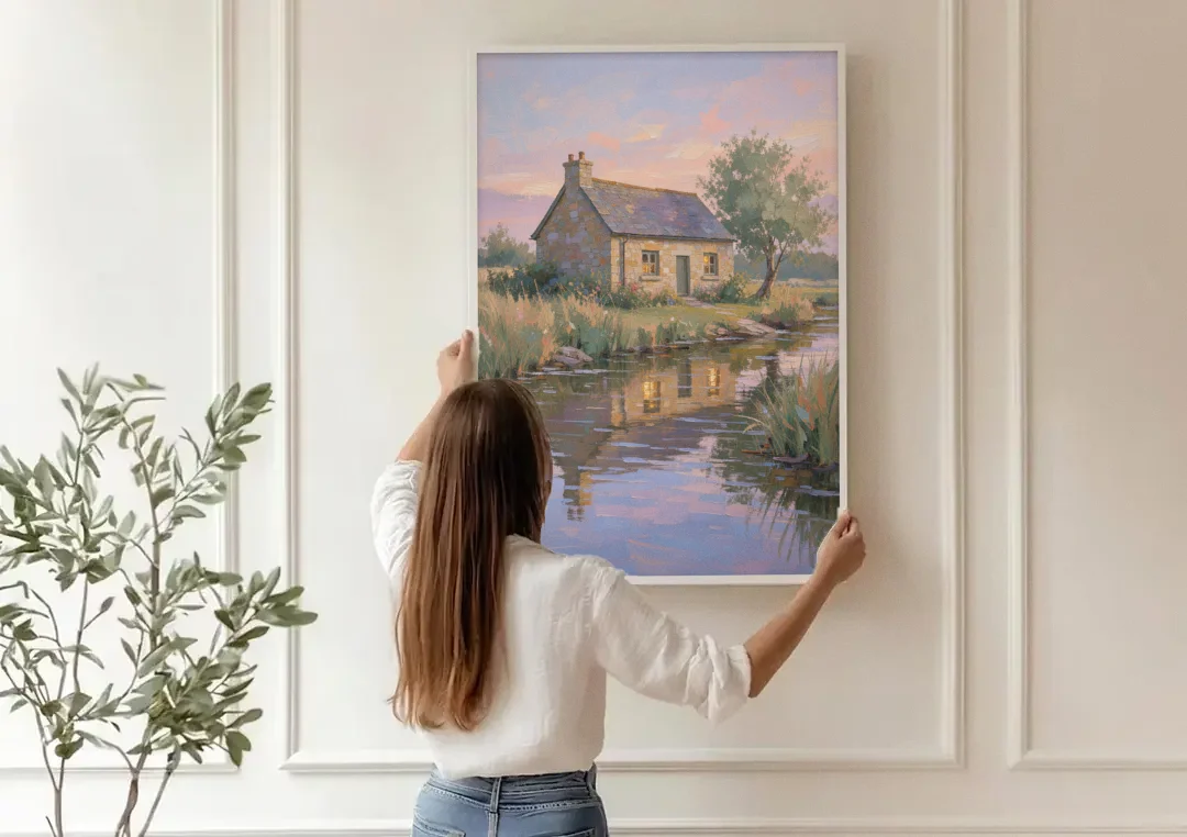 Stone Cottage Painting by the Evening Brook canvas wall art being hung on a paneled wall
