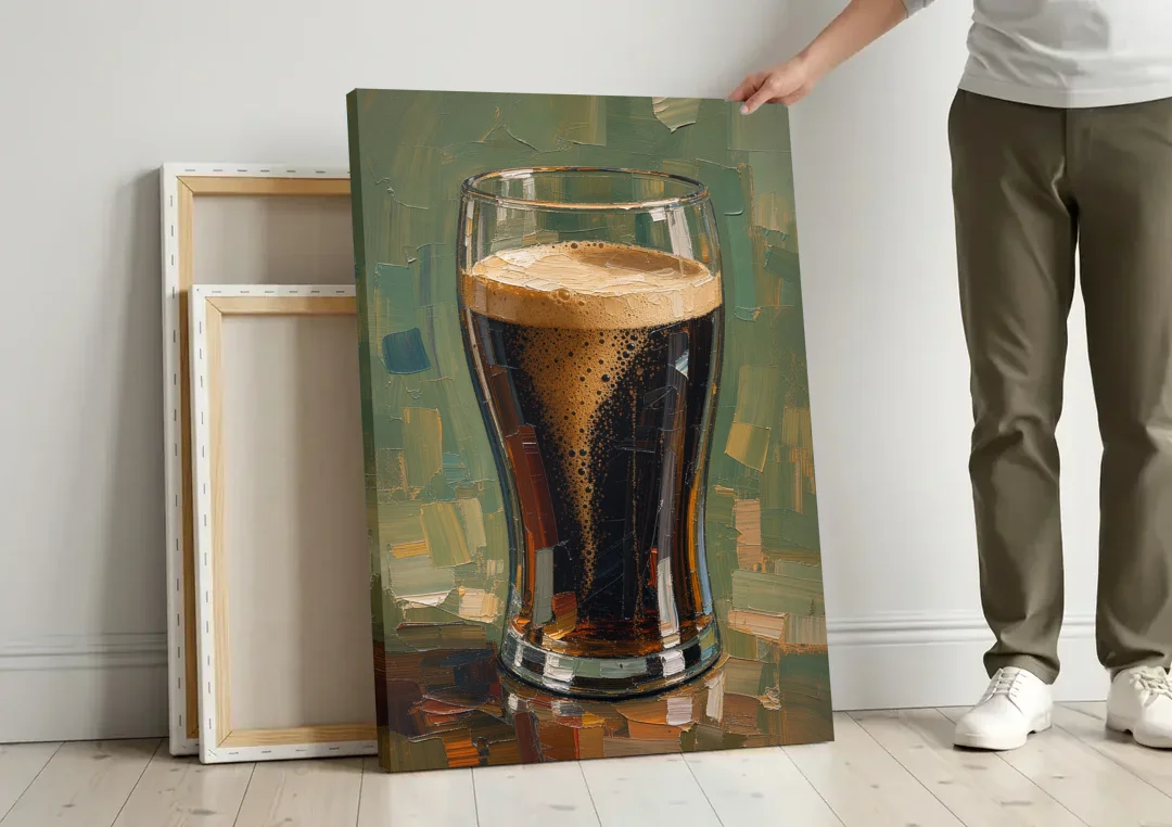 Stout Pint Settling with Cascading Bubbles canvas wall art leaning against a wall next to blank canvases