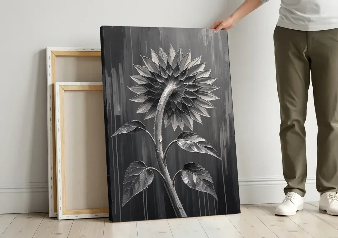 Sunflower From Behind in Silver Impasto canvas wall art leaning against a wall next to blank canvases