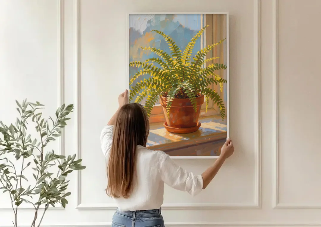 Sunlit Boston Fern in a Terracotta Pot canvas wall art being hung on a paneled wall