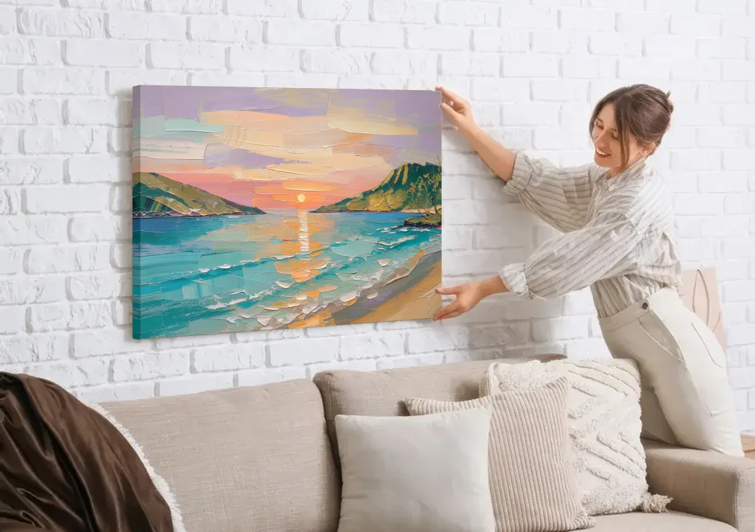 Sunrise Bay Between Sage Green Headlands canvas wall art being hung on a white brick wall above a sofa