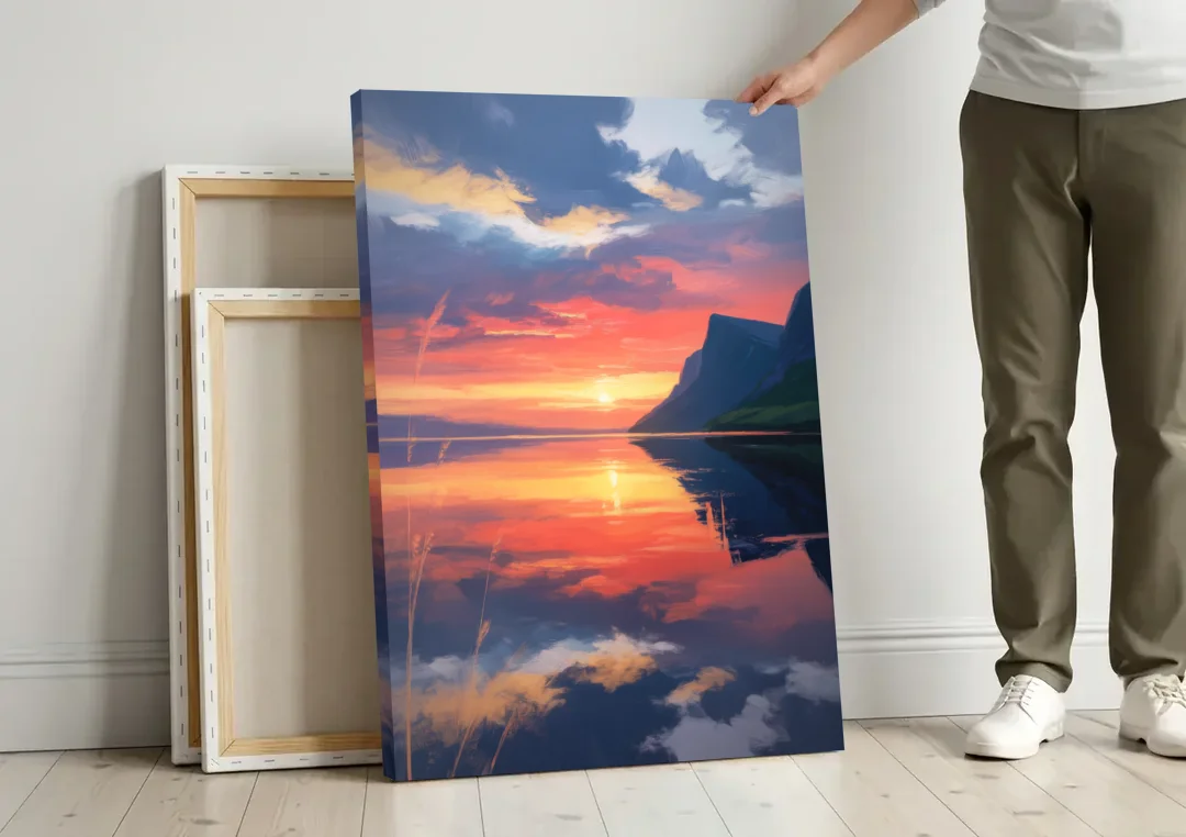 Sunset Over Gros Morne canvas wall art leaning against a wall next to blank canvases