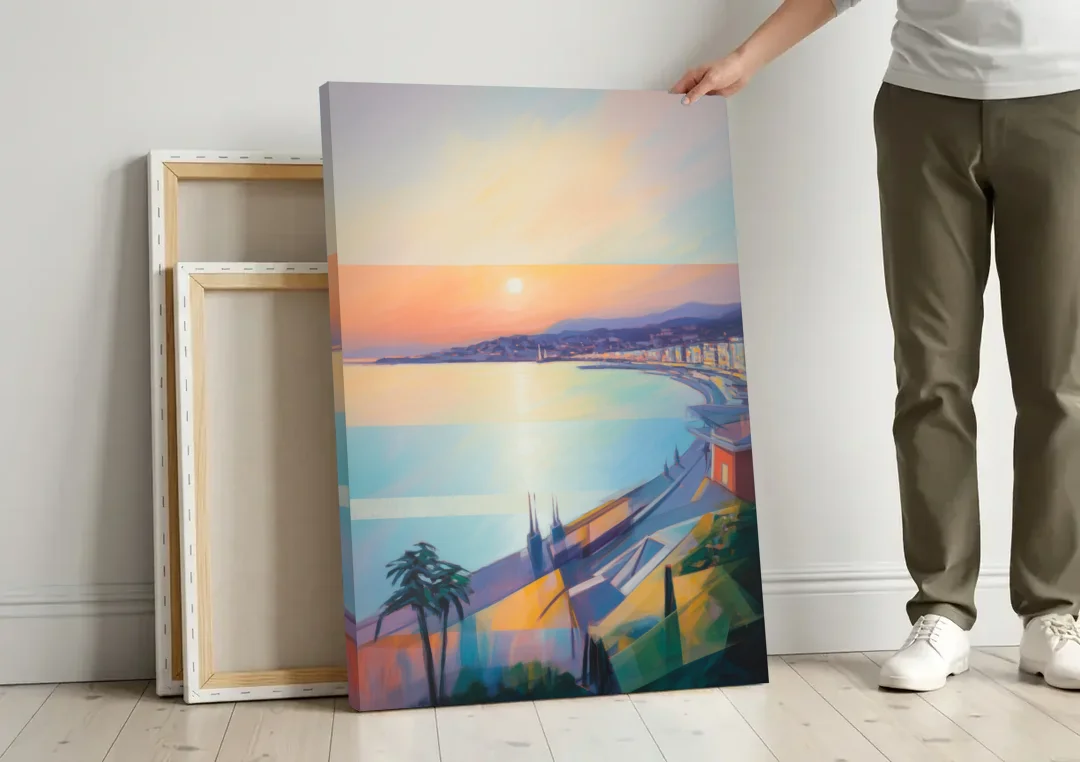 Sunset Over Nice canvas wall art leaning against a wall next to blank canvases