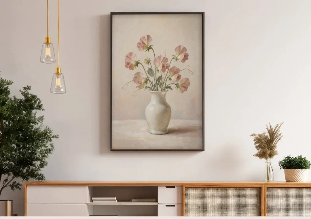 Sweet Peas in an Ivory Milk Glass Vase canvas wall art above a wooden sideboard under pendant lights