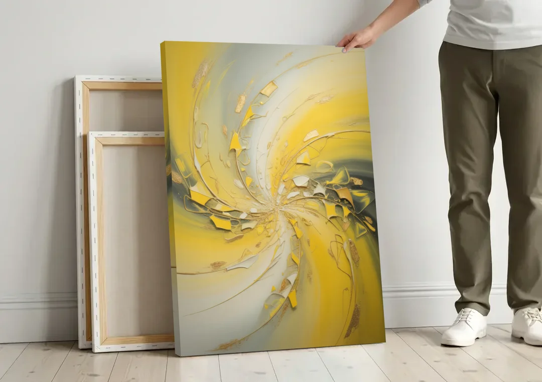 Swirling Elegance Yellow Abstract canvas wall art leaning against a wall next to blank canvases