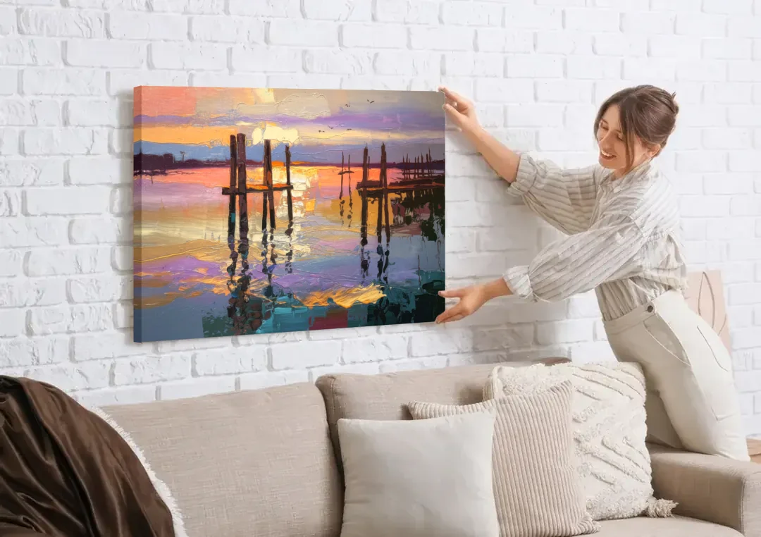 Tacoma Waterfront Sunset canvas wall art being hung on a white brick wall above a sofa
