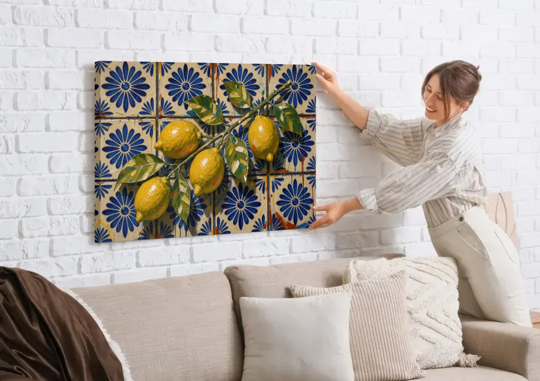 Talavera Wall Art with a Lemon Branch canvas wall art being hung on a white brick wall above a sofa