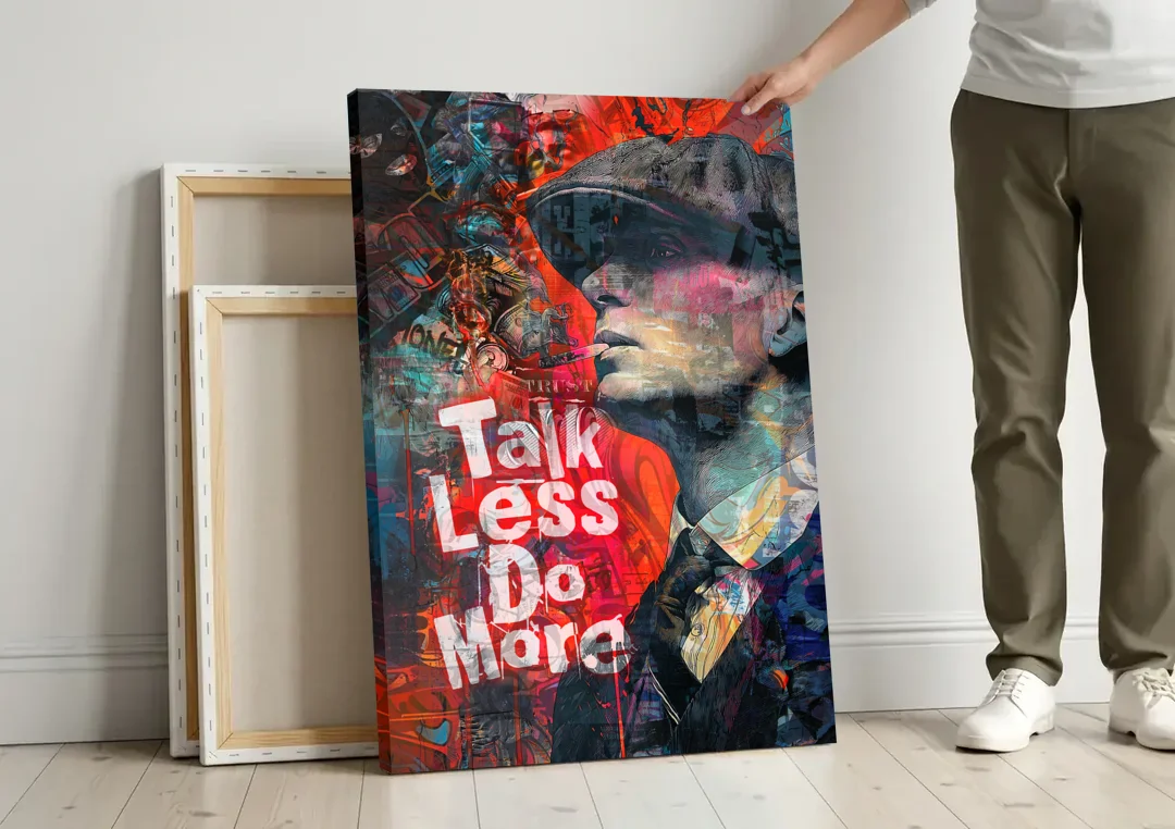 Talk Less Do More canvas wall art leaning against a wall next to blank canvases
