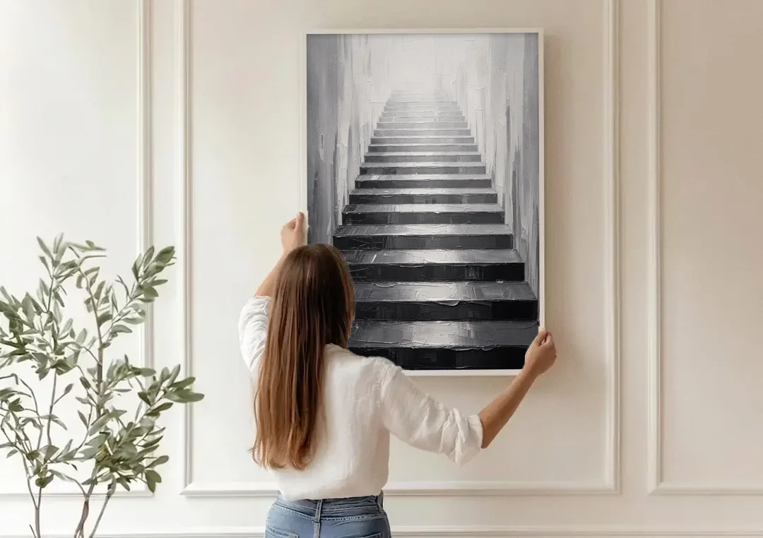 Tall Narrow Wall Art of Stairs Into White Light canvas wall art being hung on a paneled wall