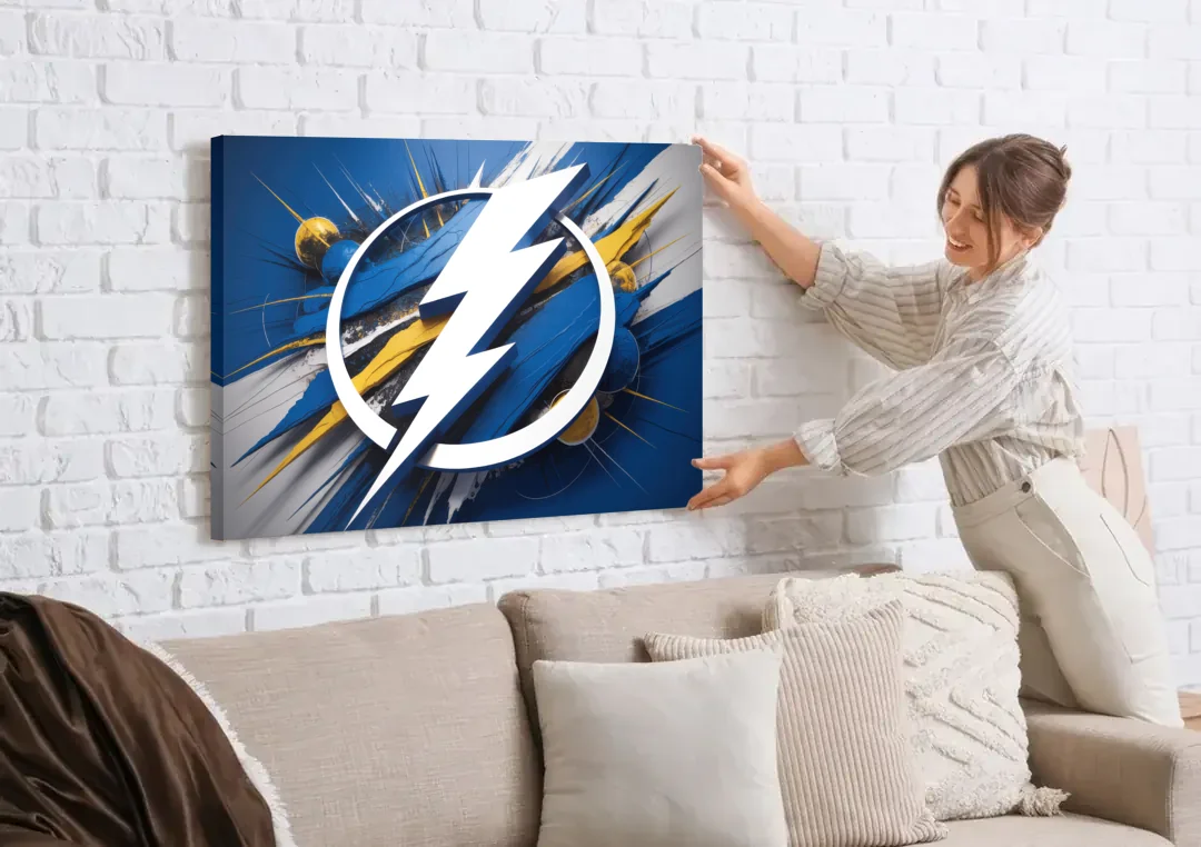 Tampa Bay Lightning Inspired Abstract Lightning Bolt Artwork canvas wall art being hung on a white brick wall above a sofa