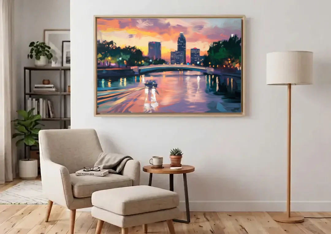 Tampa Riverwalk Evening Glow canvas wall art above an armchair in a bright living room