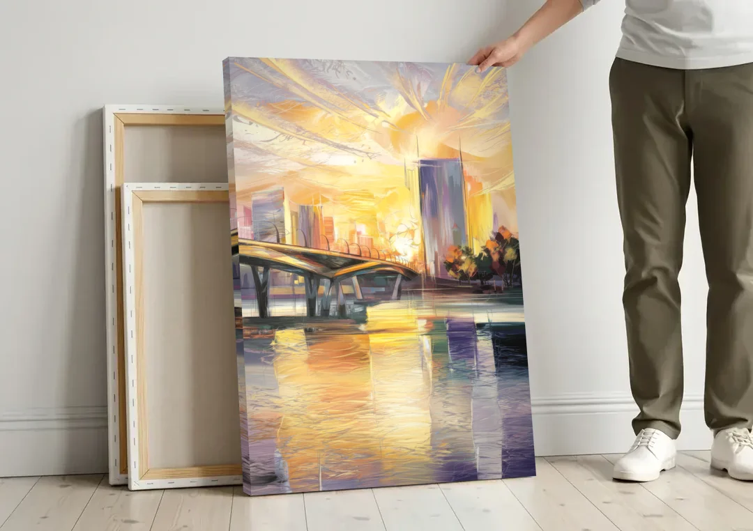 Tampa Riverwalk Sunrise canvas wall art leaning against a wall next to blank canvases