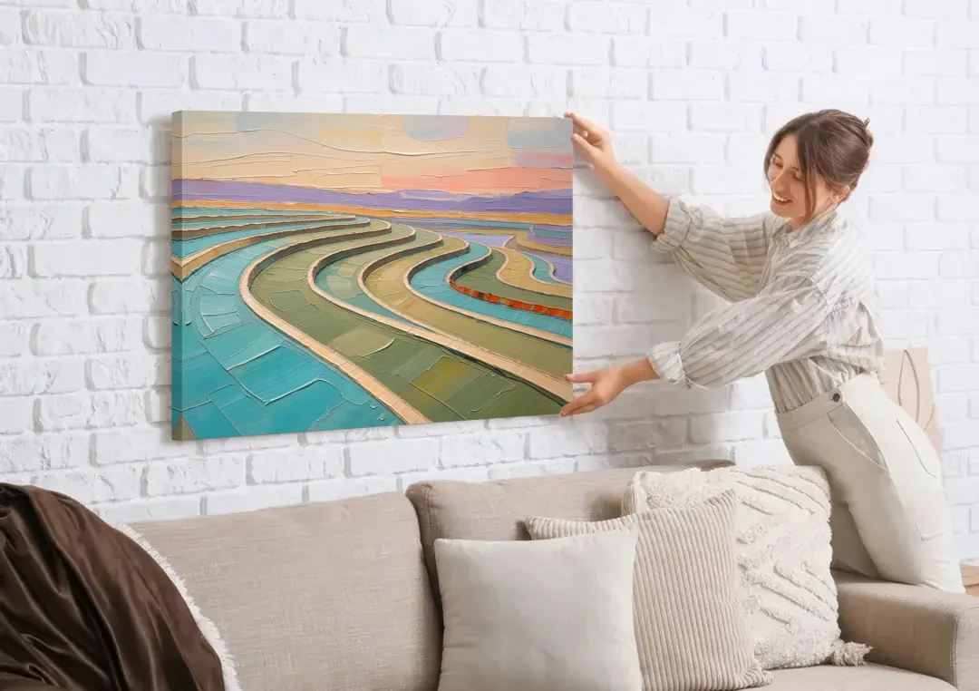 Teal and Sage Terraced Fields Abstract Landscape canvas wall art being hung on a white brick wall above a sofa