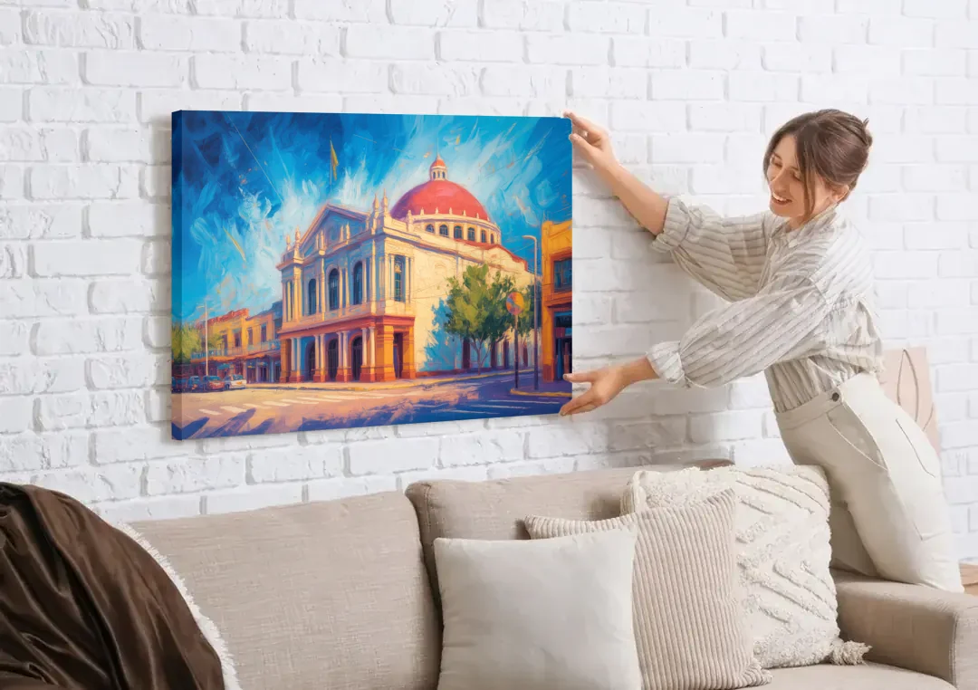 Teatro Macedonio Alcalá canvas wall art being hung on a white brick wall above a sofa