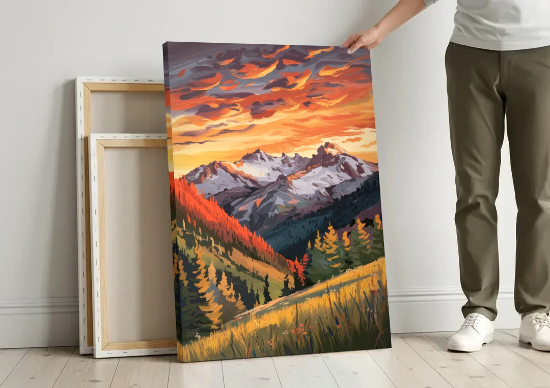 Telluride Mountain Sunset canvas wall art leaning against a wall next to blank canvases