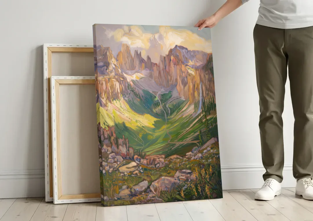 Telluride Rocky Mountain Peaks canvas wall art leaning against a wall next to blank canvases
