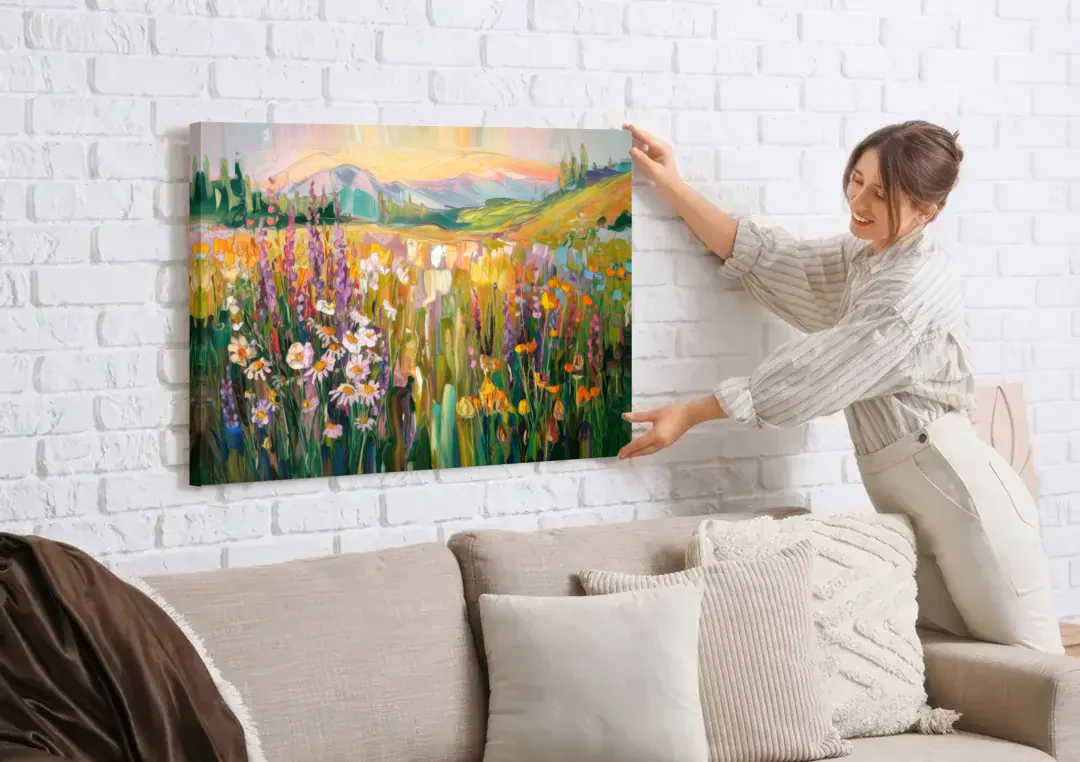 Telluride Summer Wildflowers canvas wall art being hung on a white brick wall above a sofa