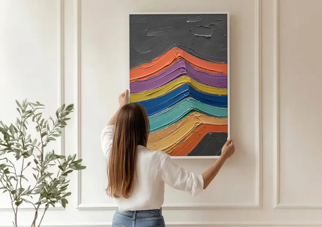 Textured Abstract Buckled Rainbow Strata canvas wall art being hung on a paneled wall