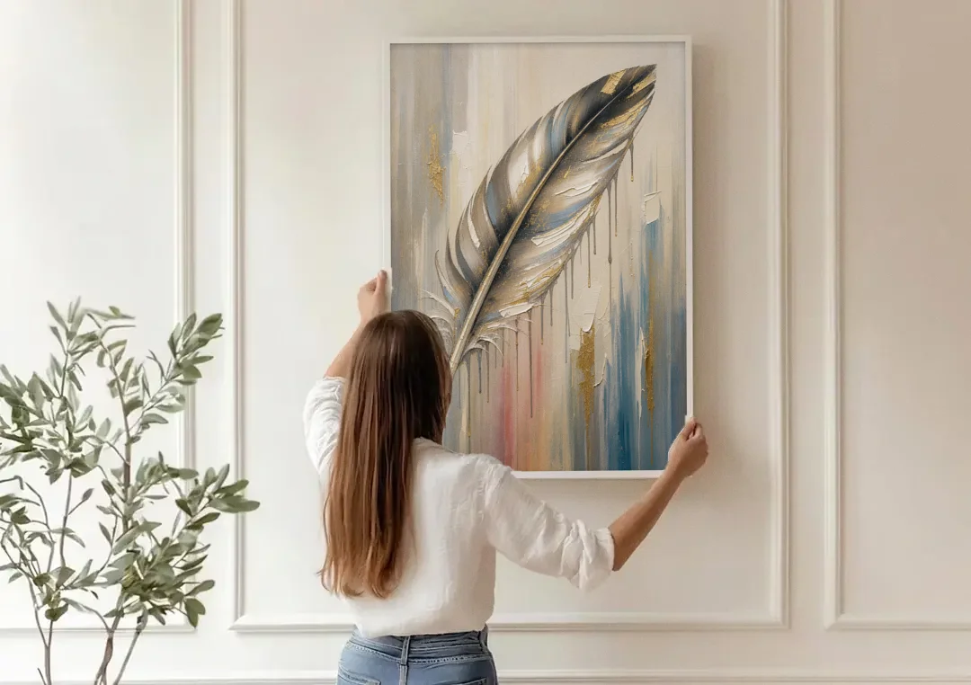 Textured Abstract Greige Gilded Feather canvas wall art being hung on a paneled wall