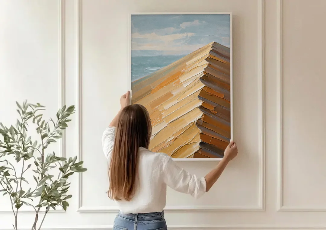Textured Beige Abstract Dune Crest canvas wall art being hung on a paneled wall