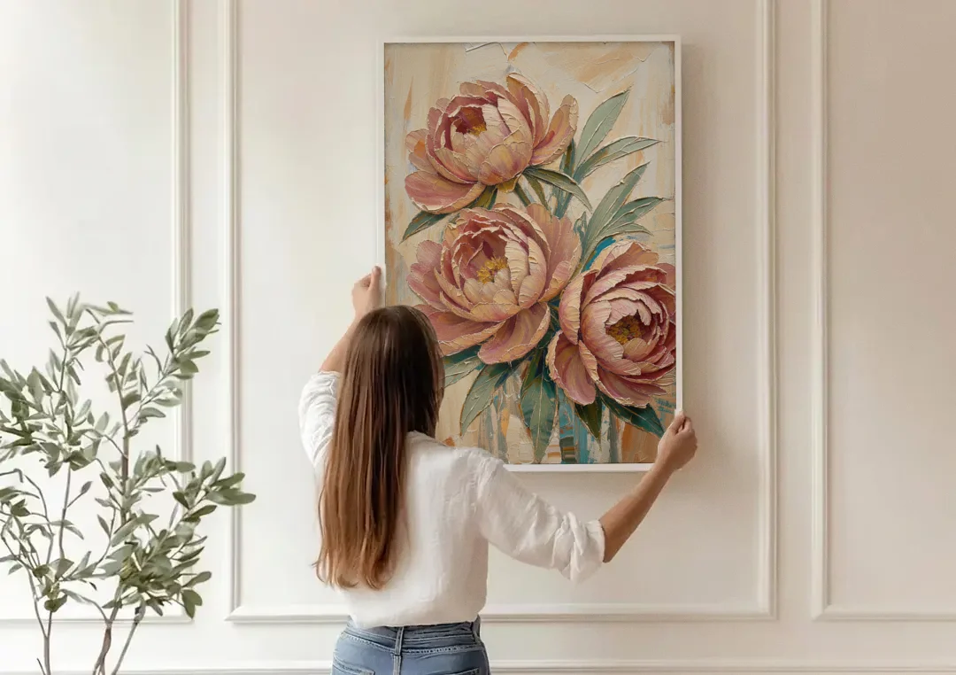 Textured Floral Painting of Three Blush Peonies canvas wall art being hung on a paneled wall
