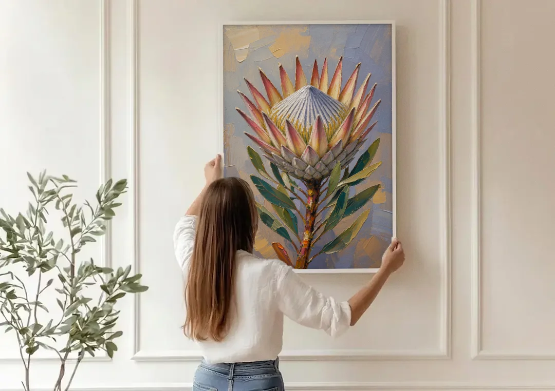 Textured Floral Wall Art of a King Protea canvas wall art being hung on a paneled wall