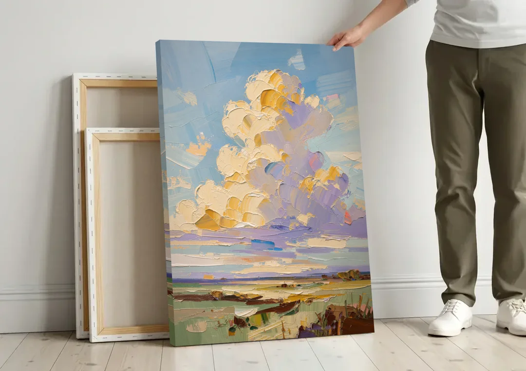 Textured Golden Cumulus Over Sage Field for the Living Room canvas wall art leaning against a wall next to blank canvases