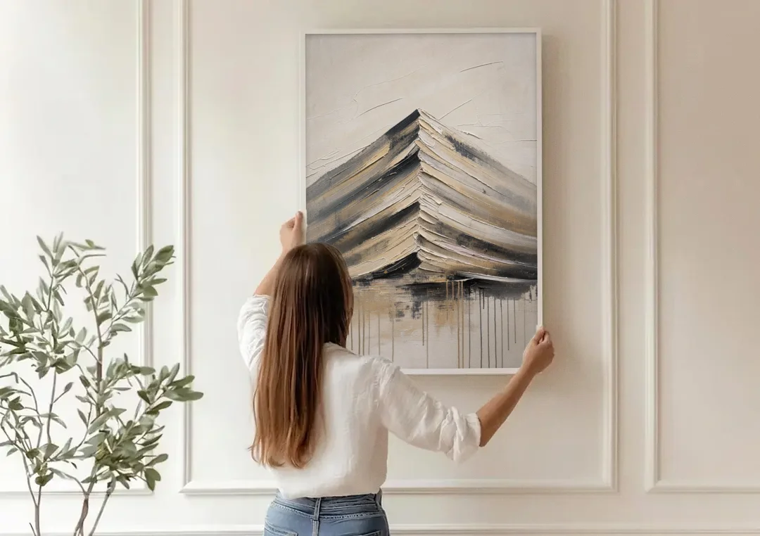 Textured Mountain Painting with Dripping Base canvas wall art being hung on a paneled wall