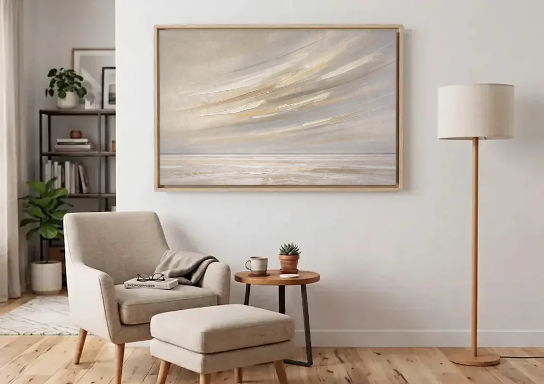 Textured Neutral Wall Art of Wind Streaks Over Flats canvas wall art above an armchair in a bright living room