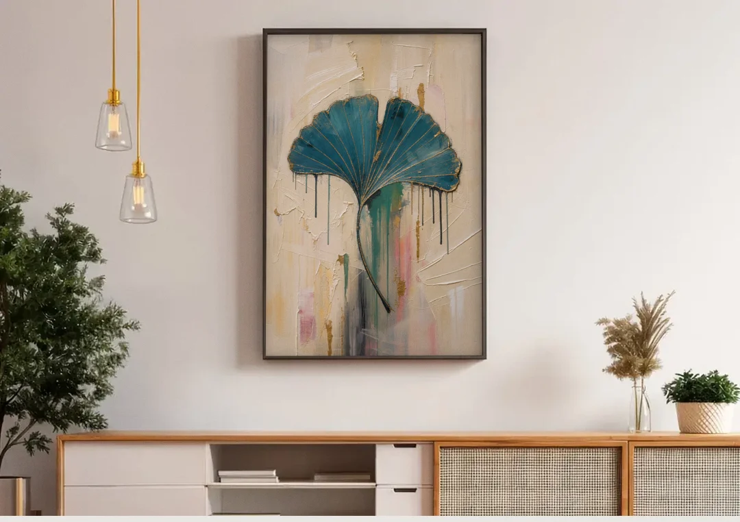 Textured Teal Ginkgo Leaf on Cream canvas wall art above a wooden sideboard under pendant lights