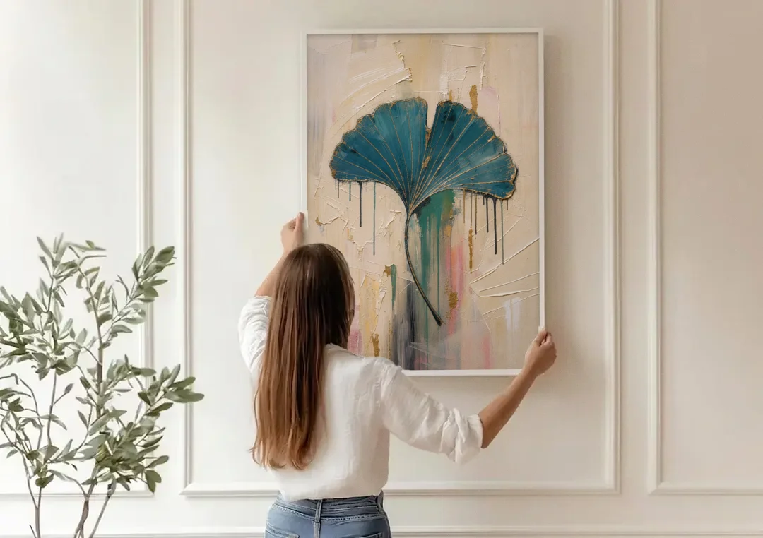 Textured Teal Ginkgo Leaf on Cream canvas wall art being hung on a paneled wall