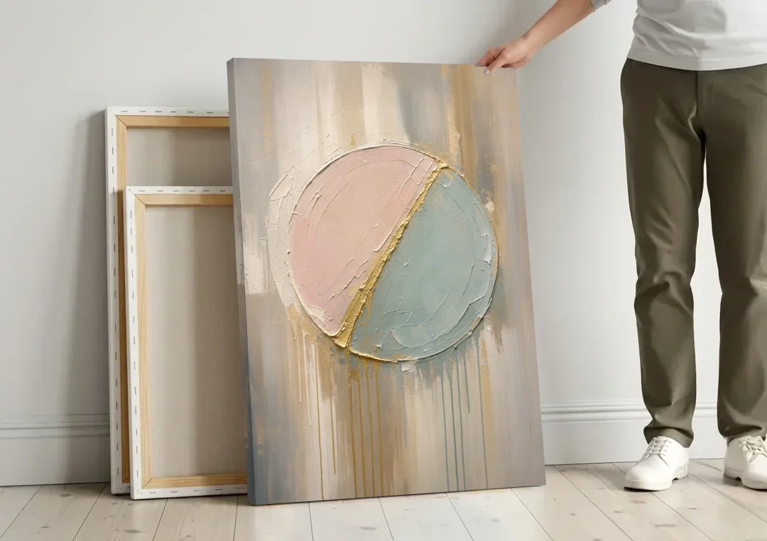Textured Wall Art with Blush and Sea Glass Halves canvas wall art leaning against a wall next to blank canvases