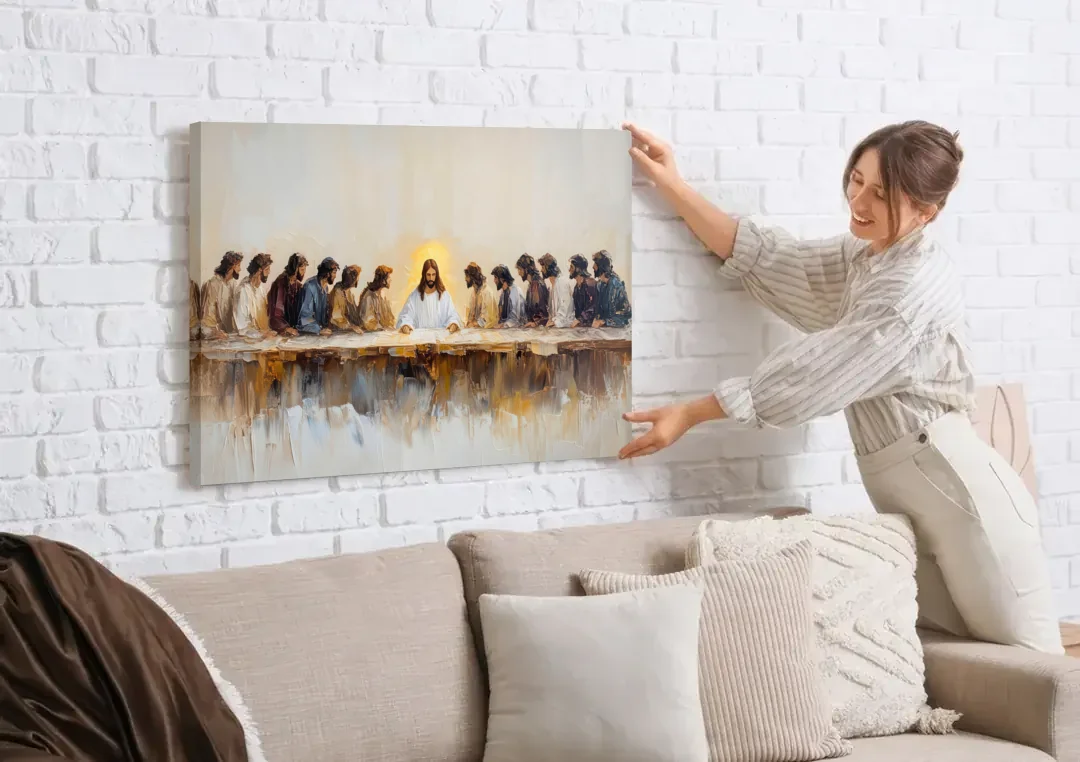 The Last Supper Modern Christian canvas wall art being hung on a white brick wall above a sofa