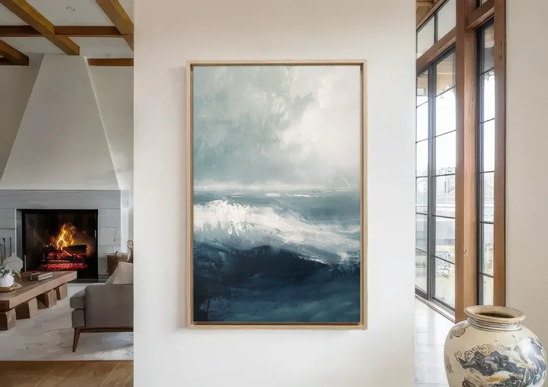 The Wave Breathes canvas wall art in a living room with a fireplace
