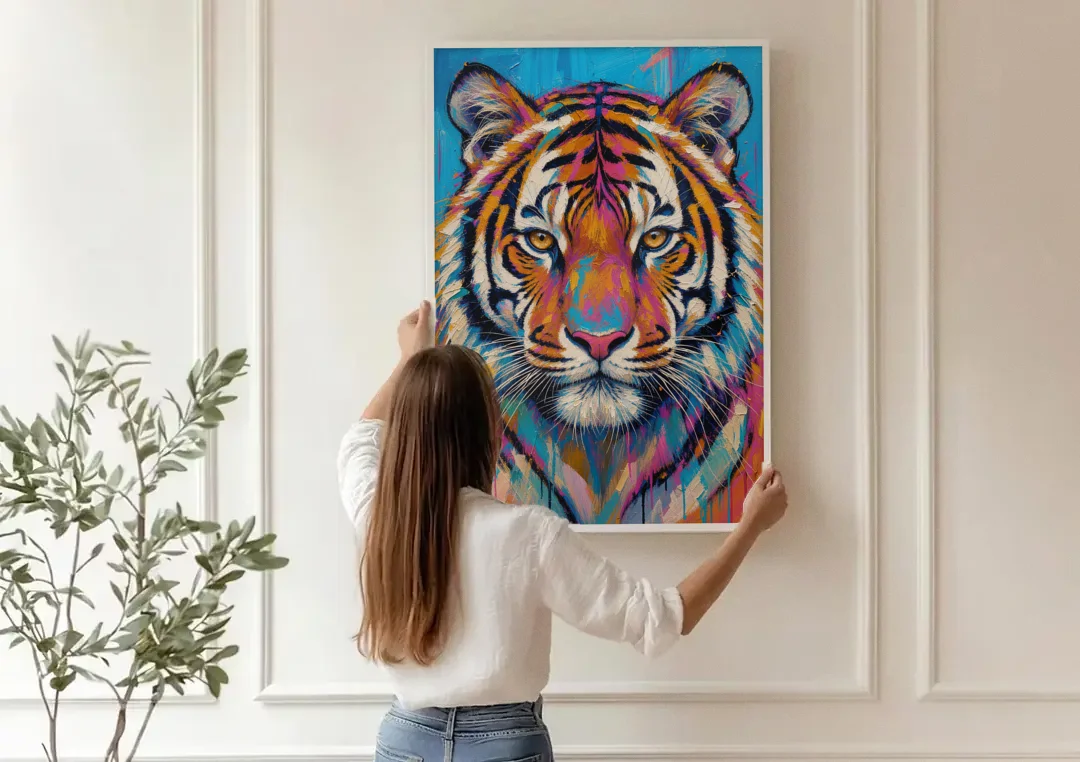 Tiger Face Canvas in Magenta and Teal canvas wall art being hung on a paneled wall
