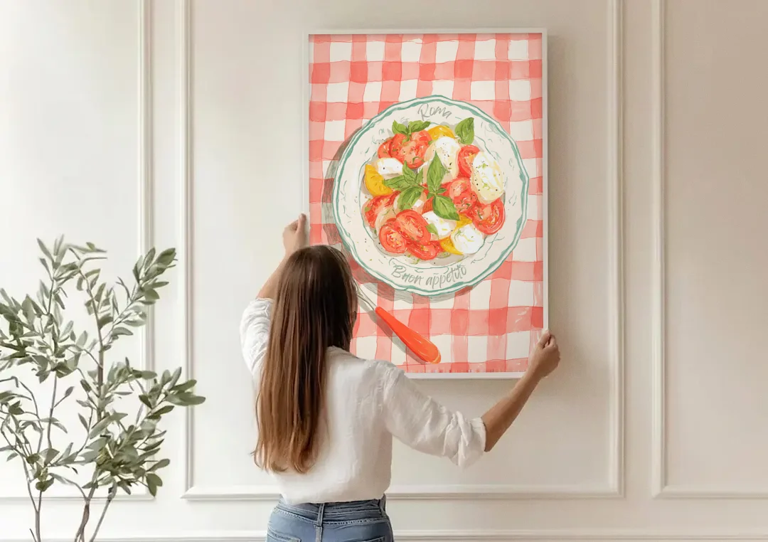 Tomato Painting of a Caprese Salad canvas wall art being hung on a paneled wall