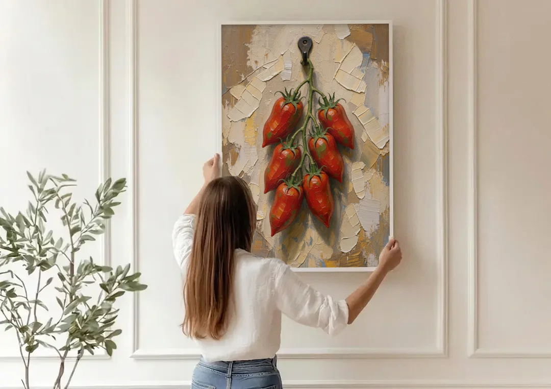 Tomatoes Wall Art on an Iron Hook canvas wall art being hung on a paneled wall