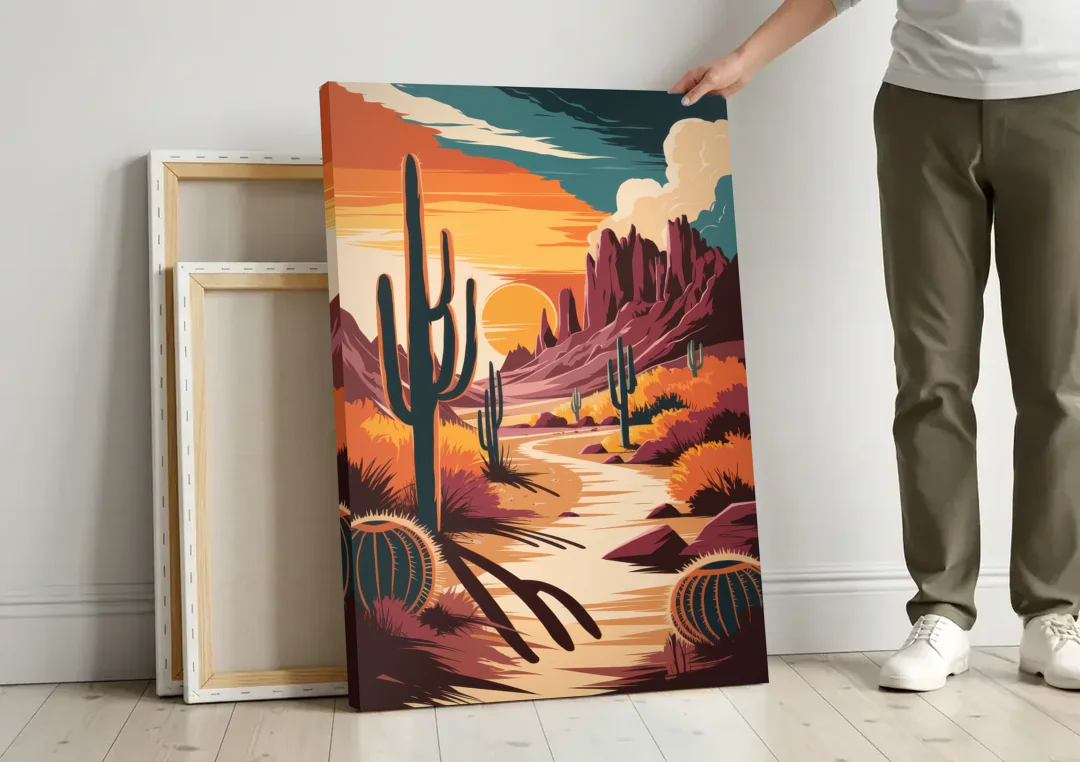 Tombstone Desert Sunset canvas wall art leaning against a wall next to blank canvases
