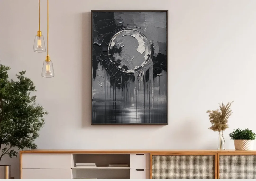 Torn Grey Circle Over Black Drips canvas wall art above a wooden sideboard under pendant lights