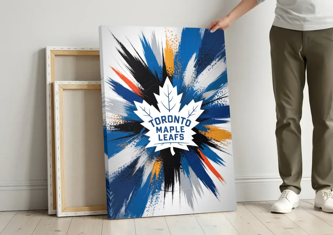 Toronto Maple Leafs Vibrant Abstract Wall Art canvas wall art leaning against a wall next to blank canvases