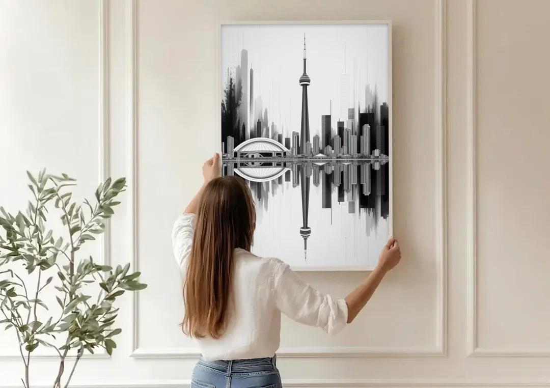 Toronto Skyline Black and White canvas wall art being hung on a paneled wall