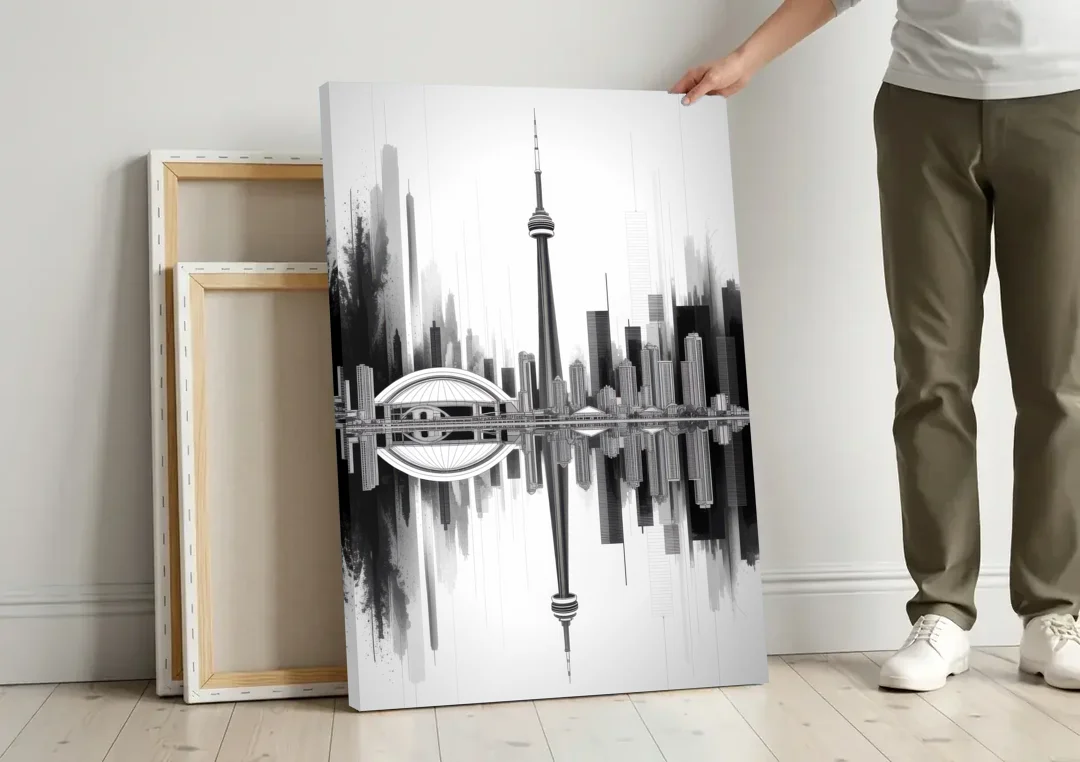 Toronto Skyline Black and White canvas wall art leaning against a wall next to blank canvases