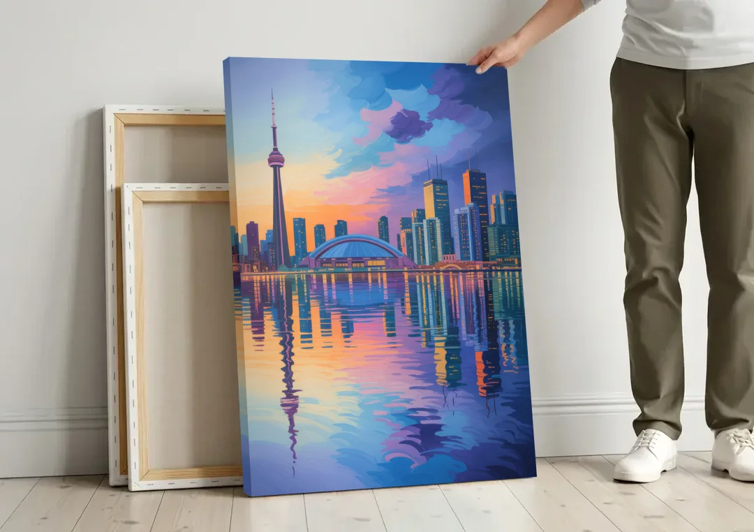 Toronto Skyline Evening Glow canvas wall art leaning against a wall next to blank canvases